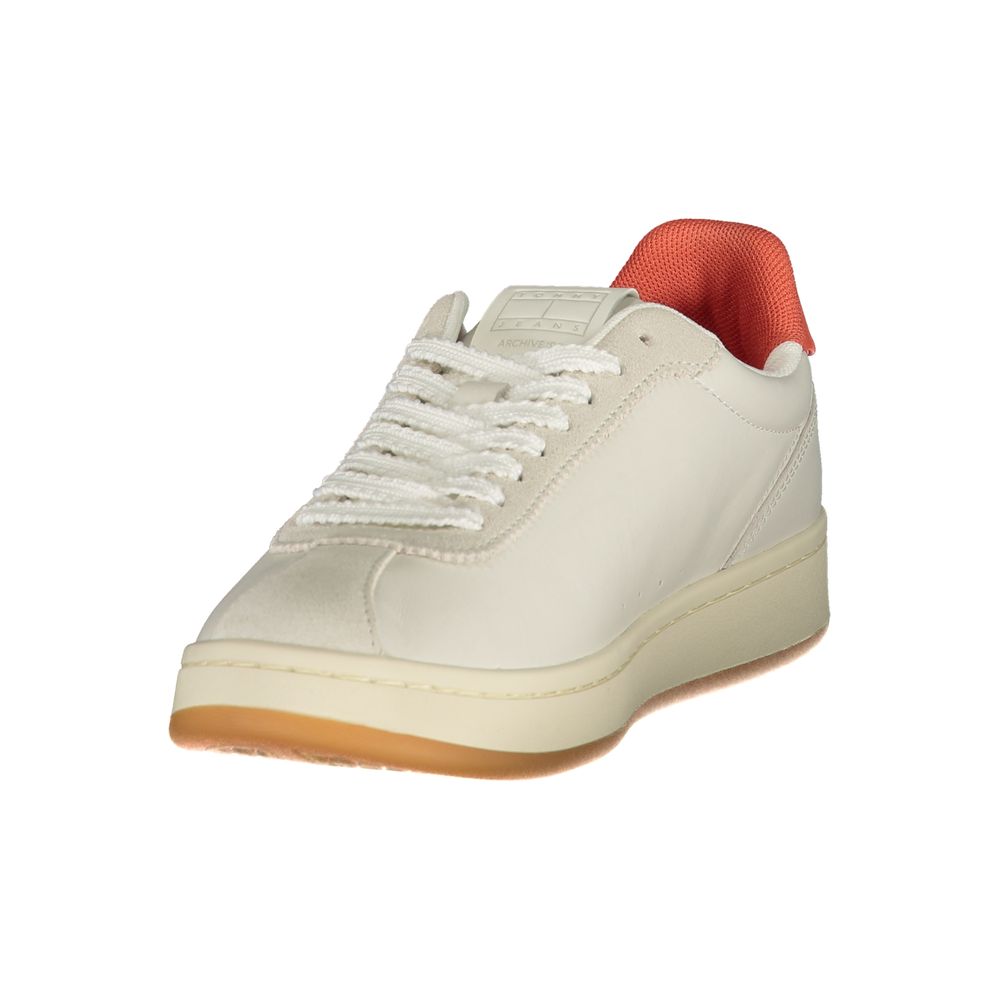 Tommy Hilfiger beige polyurethane women's sneaker with white laces, orange inner lining, and a gum rubber sole.