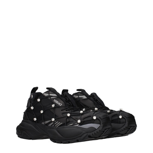 Versace black chunky sneakers in mesh and fabric, featuring crystal-studded cage overlays and thick, sculpted soles.
