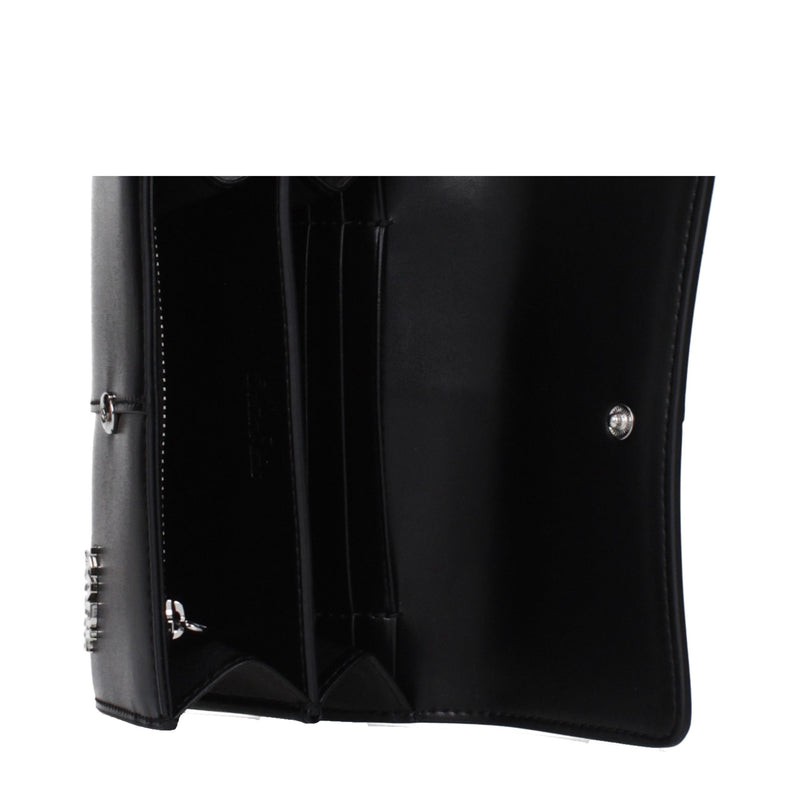 Open black polyethylene wallet showing card slots and compartments inside