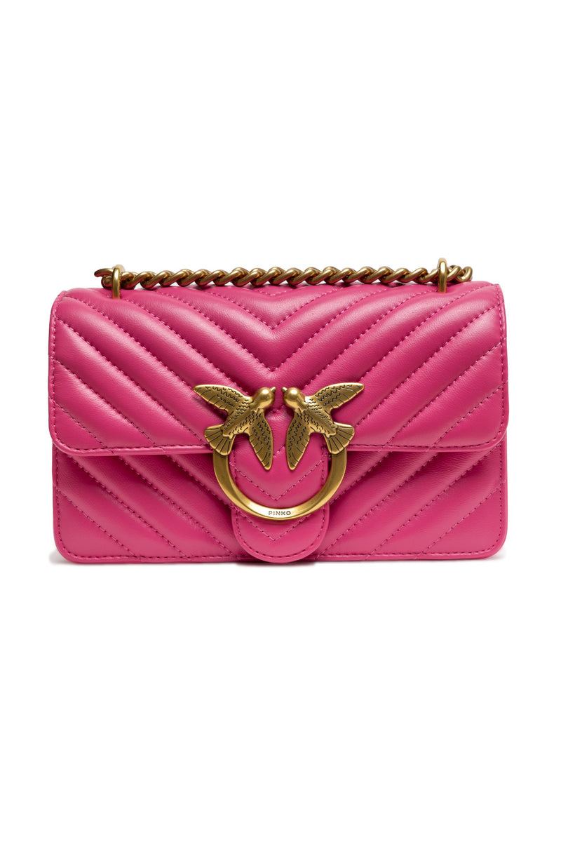 Pink quilted leather mini shoulder bag with gold chain strap and metal bird clasp