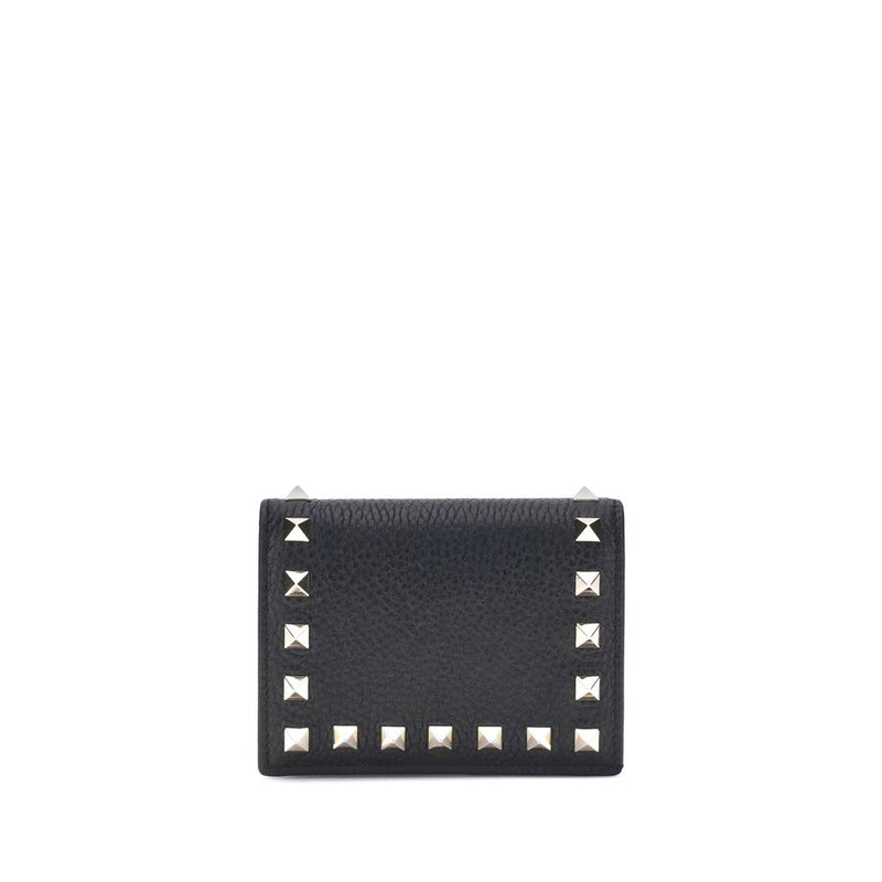 Black textured leather wallet with silver pyramid studs along the edges