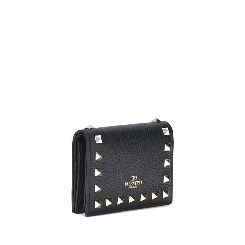 Black pebbled leather wallet featuring silver pyramid studs and Valentino Garavani logo