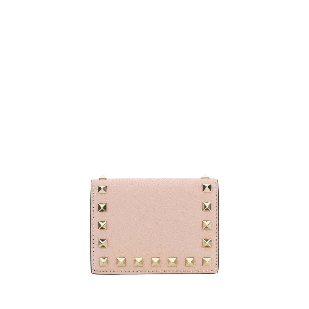 Pink calf leather Valentino Garavani wallet with gold-tone pyramid studs along the borders.