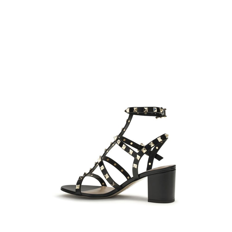 Black leather heeled sandal with studded strappy design