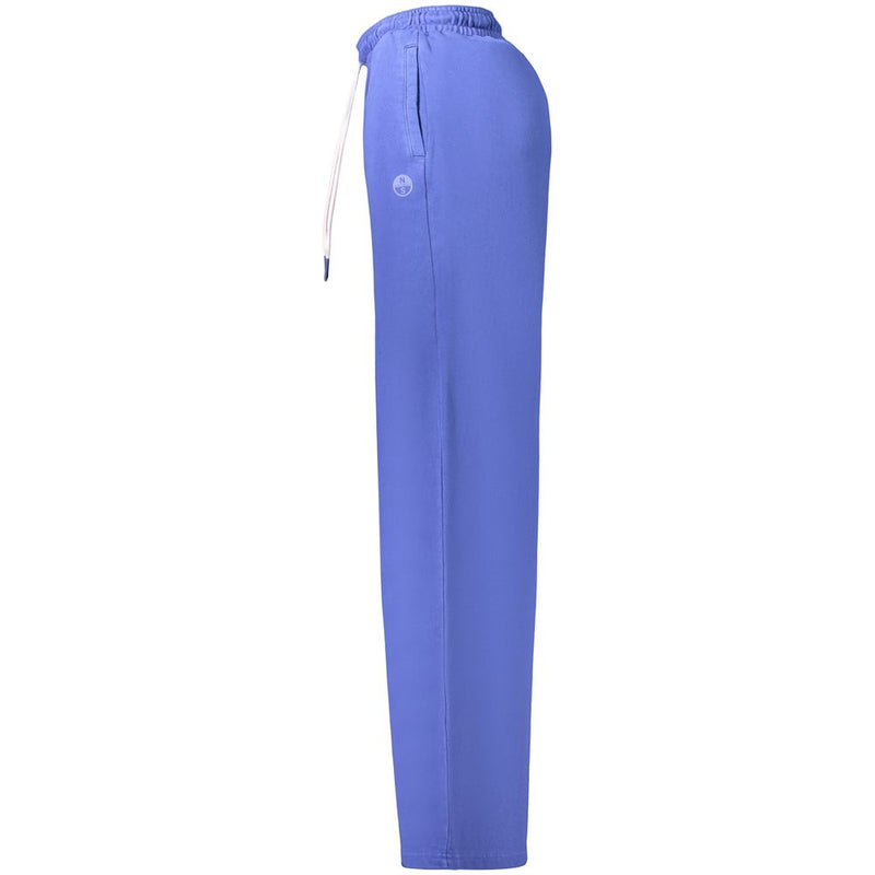 Side view of blue cotton women's sweatpants with elastic drawstring waist and small logo