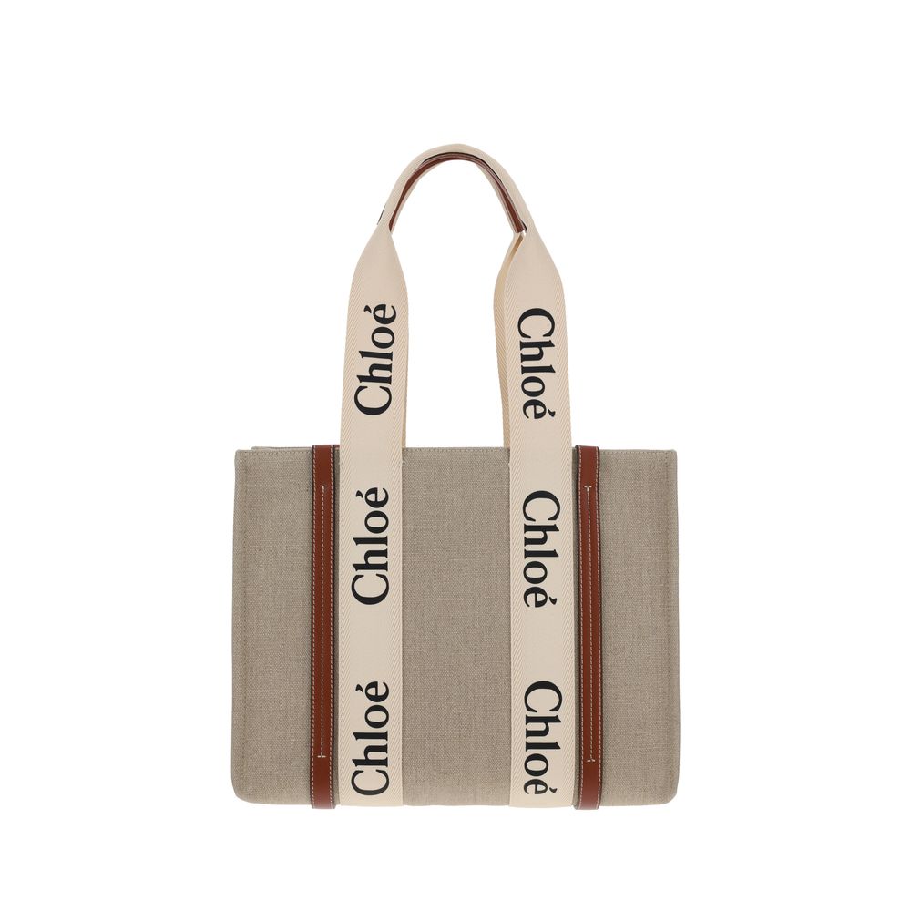 Chloé beige linen tote bag with brown leather trim and cream handles featuring black Chloé logos.