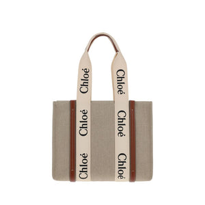 Chloé beige linen tote bag with brown leather trim and cream handles featuring black Chloé logos.
