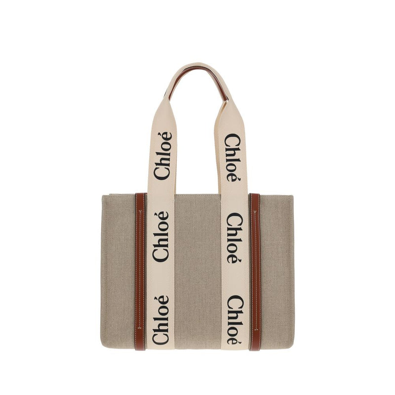 Chloé beige linen tote bag with brown leather trim and cream handles featuring black Chloé logos.