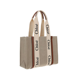 Chloé beige linen tote bag with cream branded straps and brown leather trim.