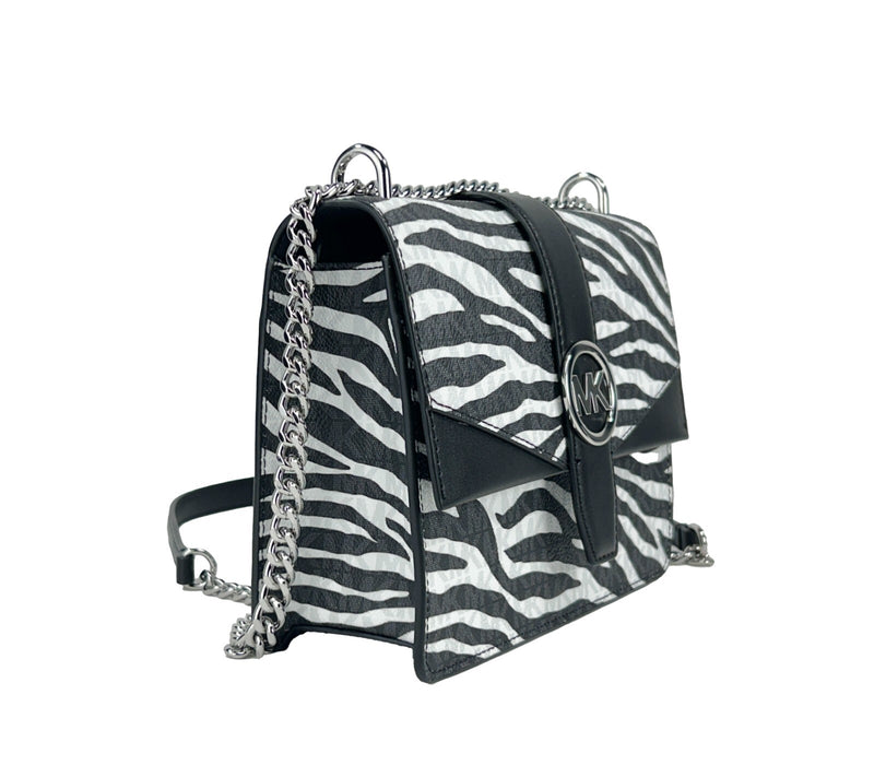 Black and white zebra print leather crossbody bag with silver chain strap and MK logo clasp