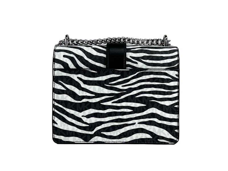 Black and white zebra print crossbody bag with chain strap and MK logo pattern