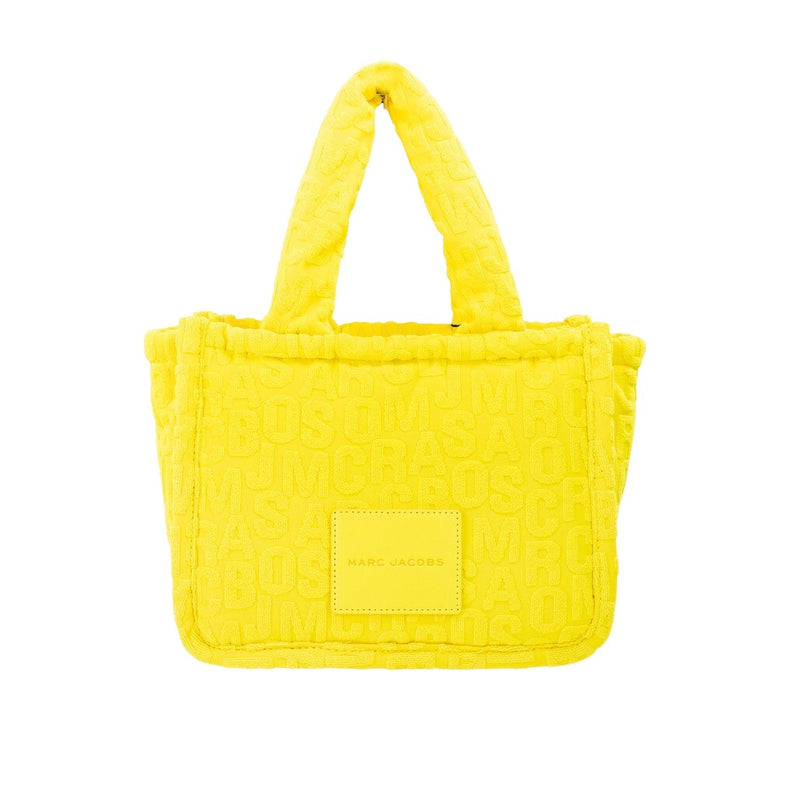 Bright yellow terrycloth tote bag with embossed monogram pattern and dual top handles