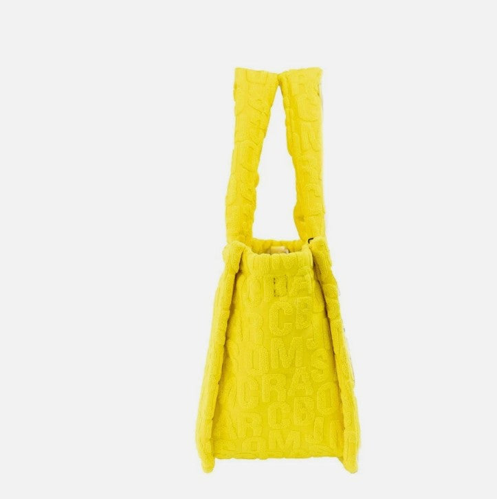 Golden yellow terry cloth small tote bag with embossed monogram pattern