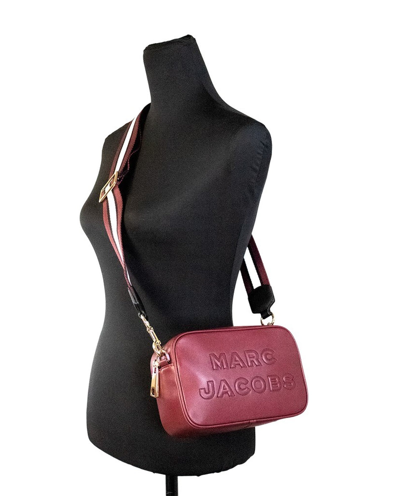 Pomegranate smooth leather Marc Jacobs embossed camera crossbody bag on mannequin