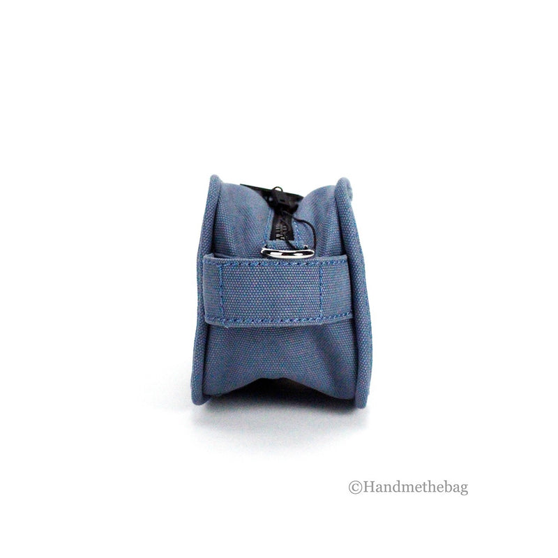 Blue canvas camera bag shown from the side with zipper and handle detail