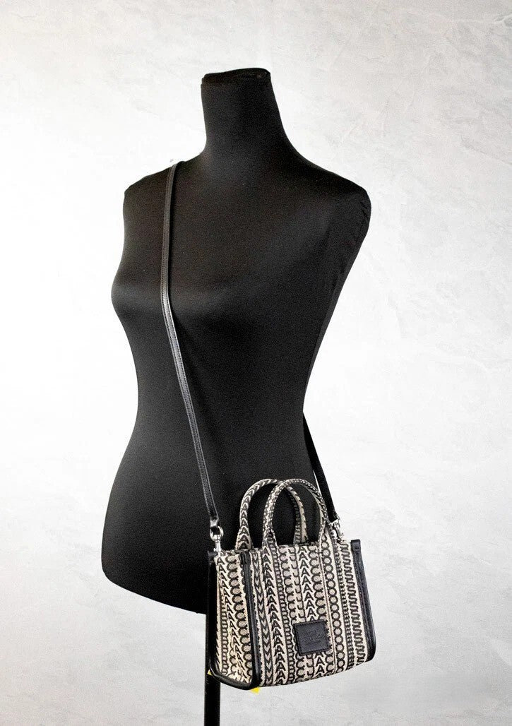 Beige and black woven jacquard canvas mini tote handbag with monogram pattern and dual top handles