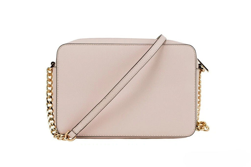 Powder blush pink leather crossbody bag with a gold chain strap
