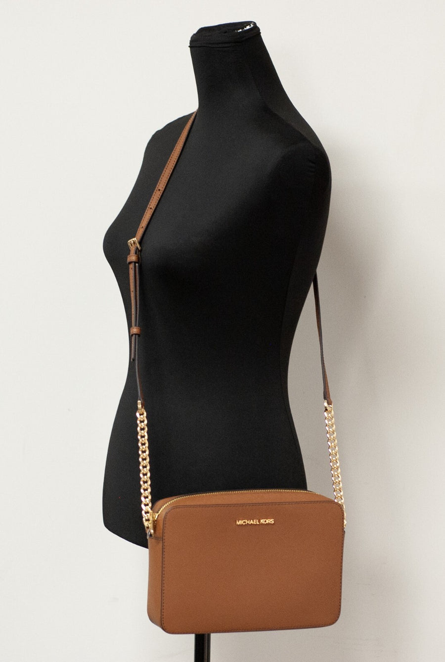 Brown leather cross body bag with gold chain strap