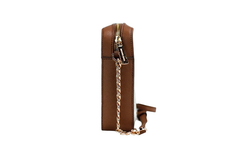 Side view of a brown and cream leather crossbody bag with gold zipper and chain strap