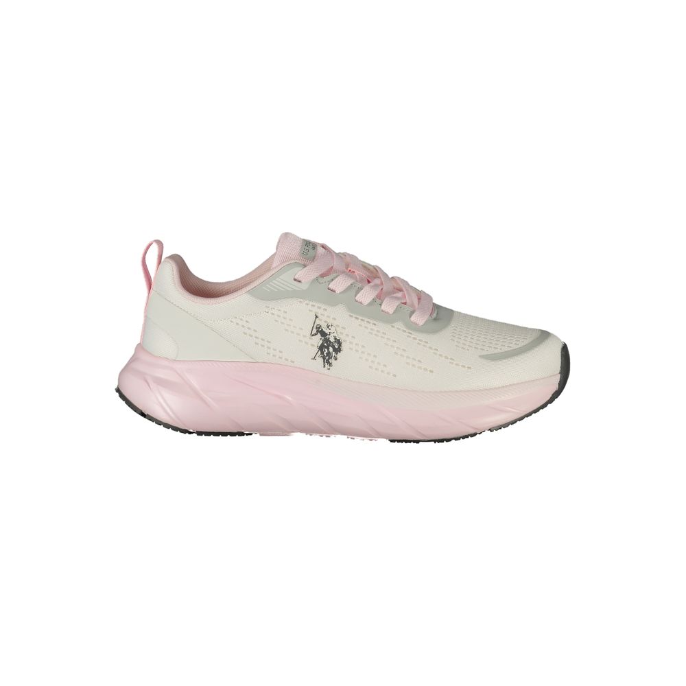 Female model wearing U.S. POLO ASSN. white polyurethane women's sneakers with a clean white upper, signature polo branding, and sporty white sole, captured mid-step in a casual lifestyle pose showcasing the shoe's sleek profile and everyday athletic style.