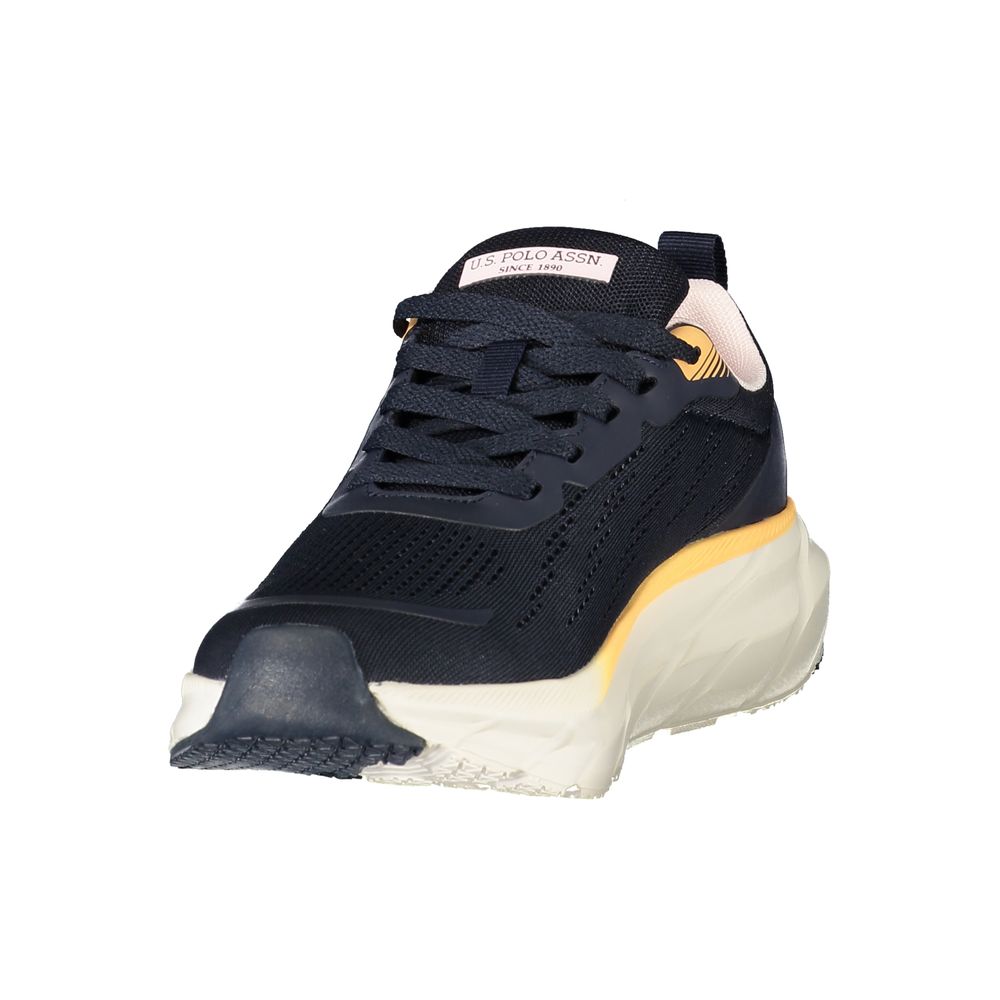 Female model wearing U.S. POLO ASSN. blue fabric women's sneakers with a breathable textile upper, signature polo branding, and sporty white sole, captured mid-step in a casual lifestyle pose showcasing the shoe's vibrant blue profile and everyday athletic style.