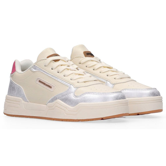Beige sneakers with silver accents on a white background