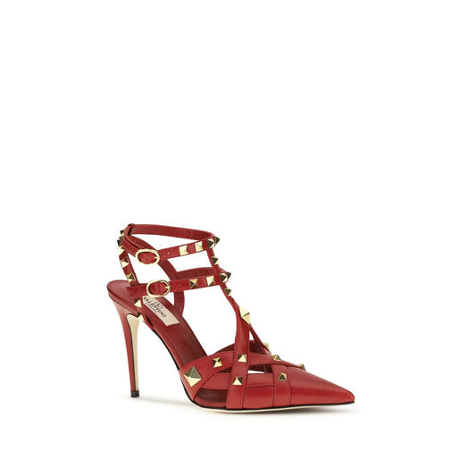 Red goatskin pointed-toe high heel pumps with gold-tone stud embellishments, caged straps, and buckle closures.