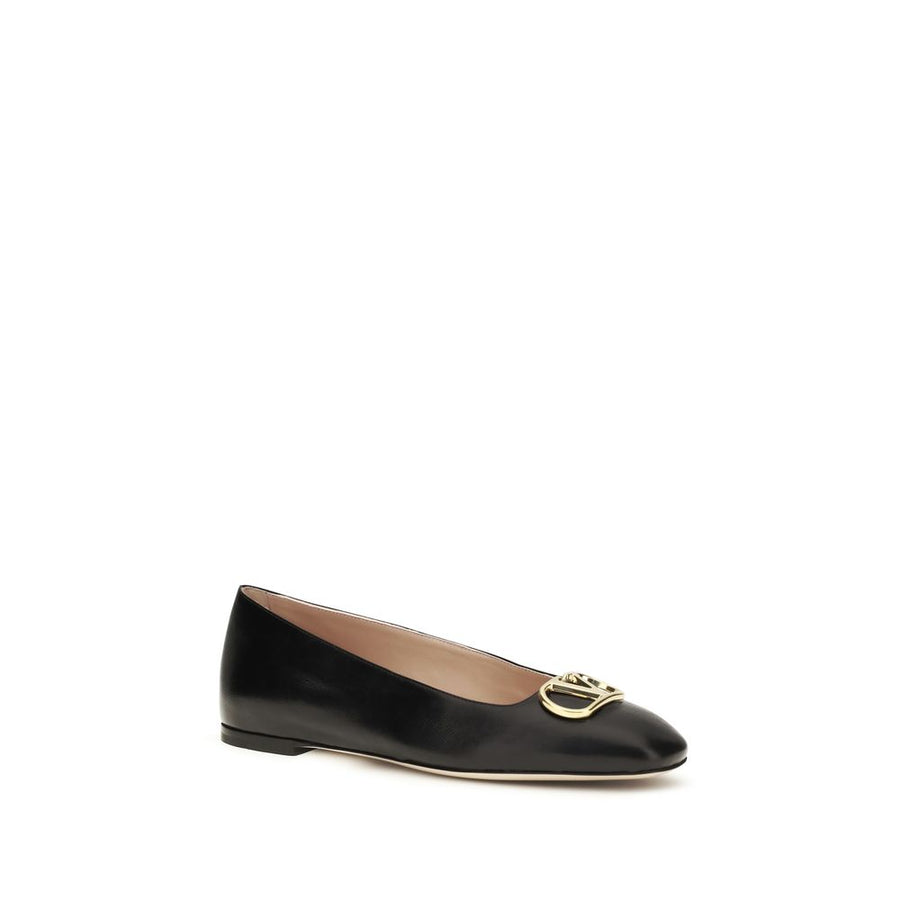 Black calf leather ballet flat with a rounded toe and a gold-tone metal VLogo hardware detail on the top.