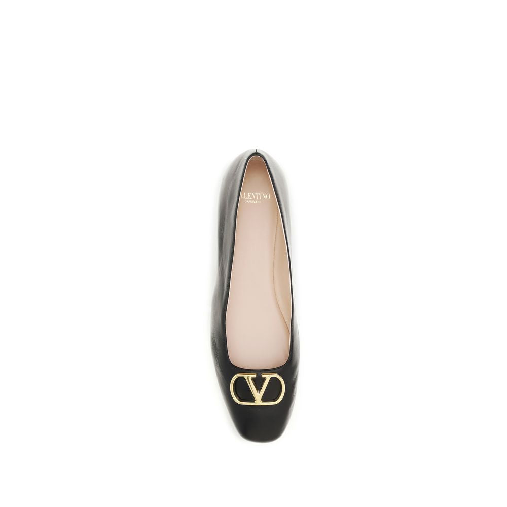 Black leather Valentino Garavani ballet flats with a gold-tone VLOGO plaque on the square toe.