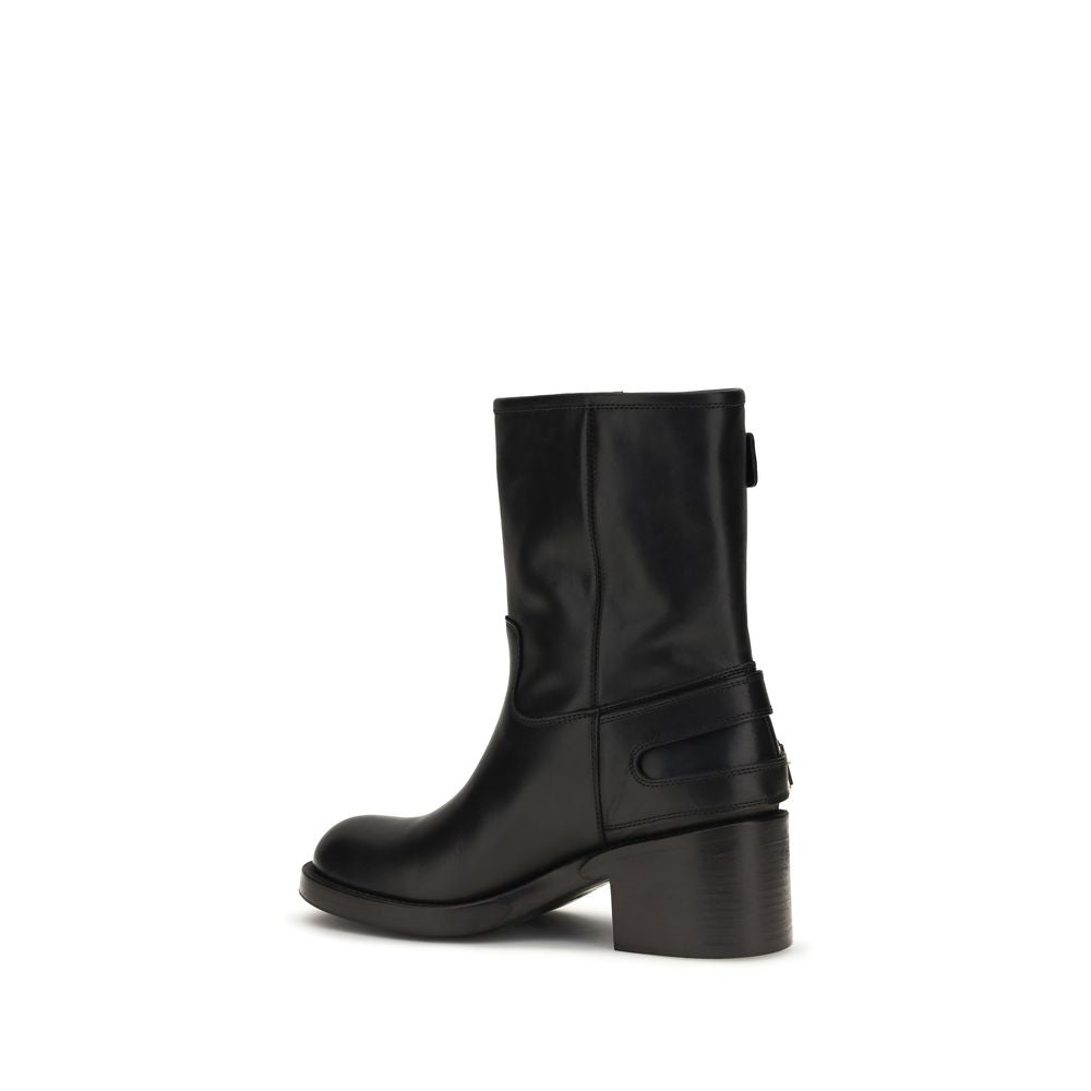 Chloé black calf leather ankle boots with a round toe, structured mid-calf shaft, and a sturdy block heel.