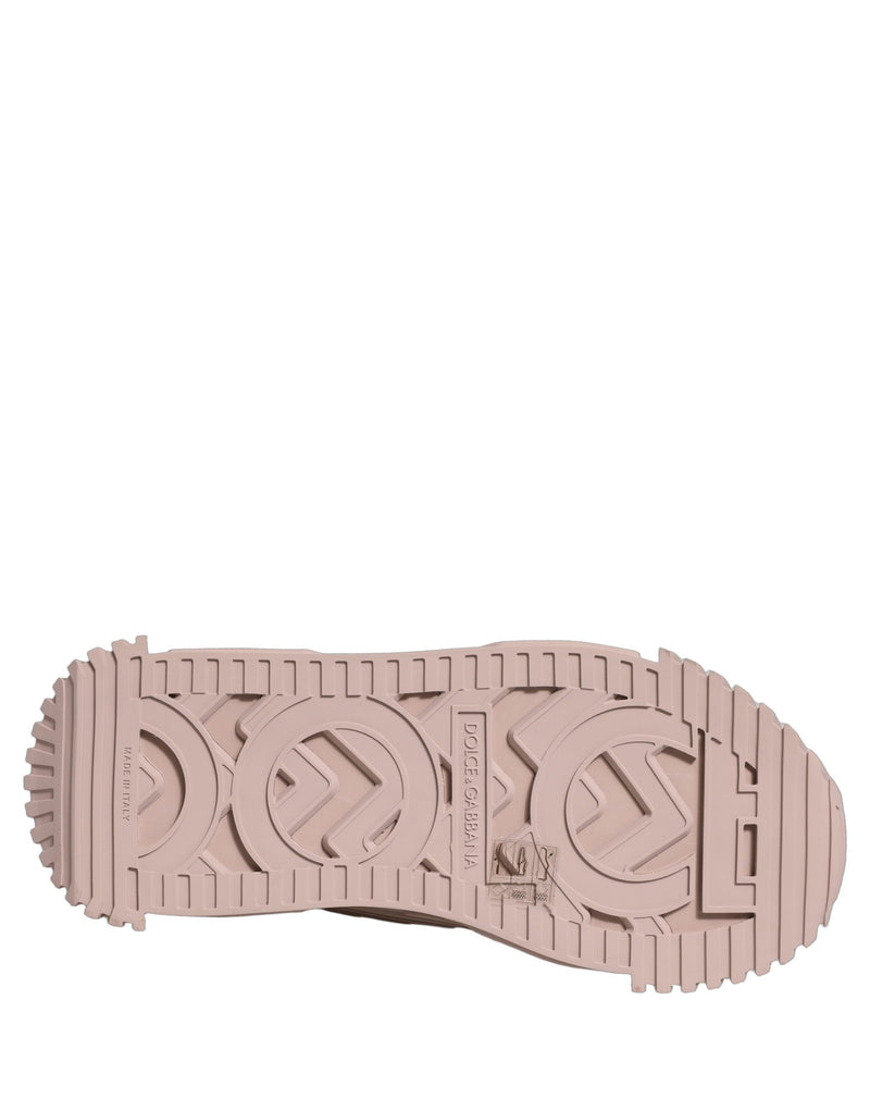 Pink rubber sneaker sole with embossed Dolce and Gabbana logo tread