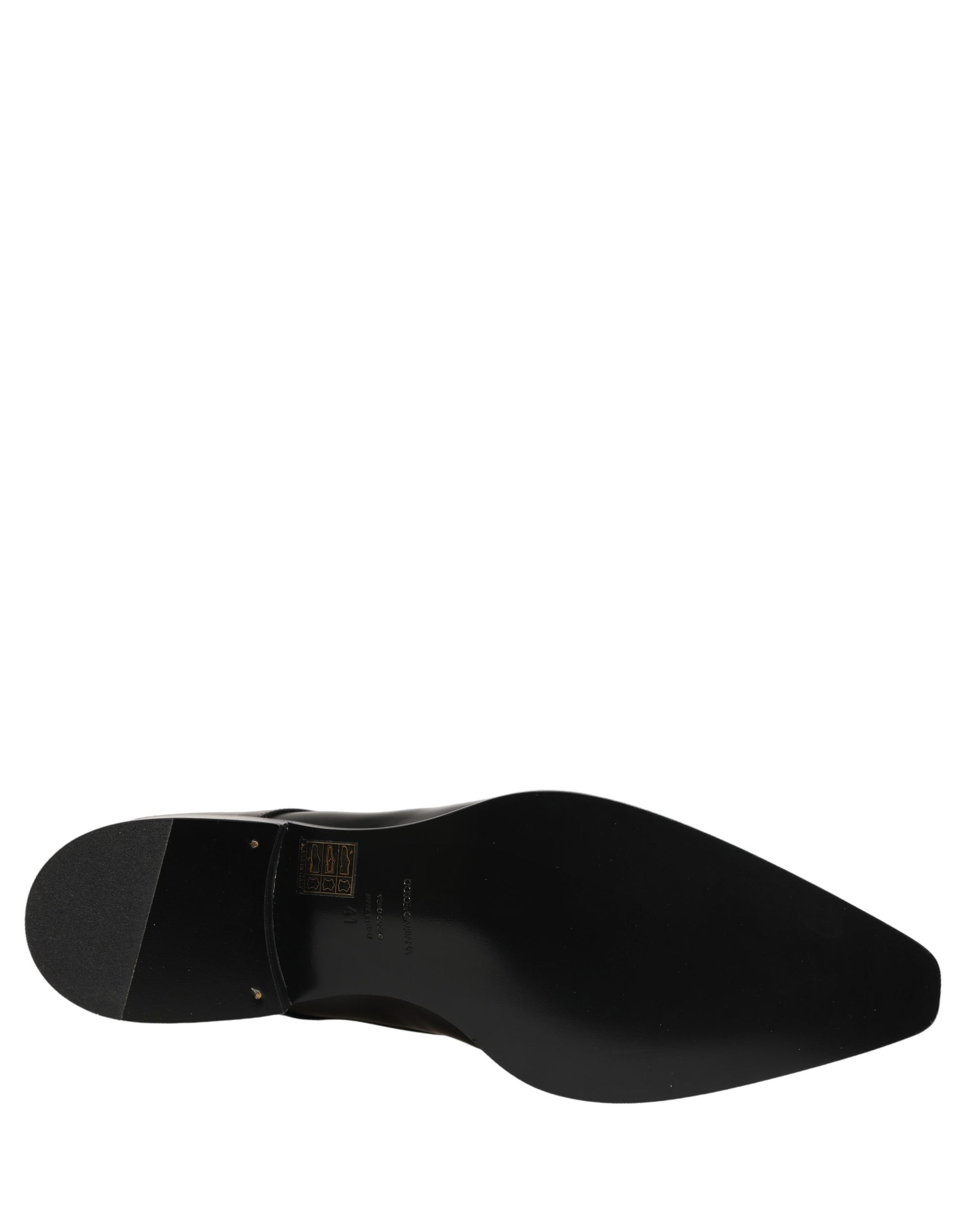 Female model wearing sleek black polished leather Derby shoes with a square toe, clean lace-up front, structured block heel, and high-gloss finish, captured mid-step in a casual lifestyle pose showcasing the shoe's sharp profile and sophisticated silhouette.