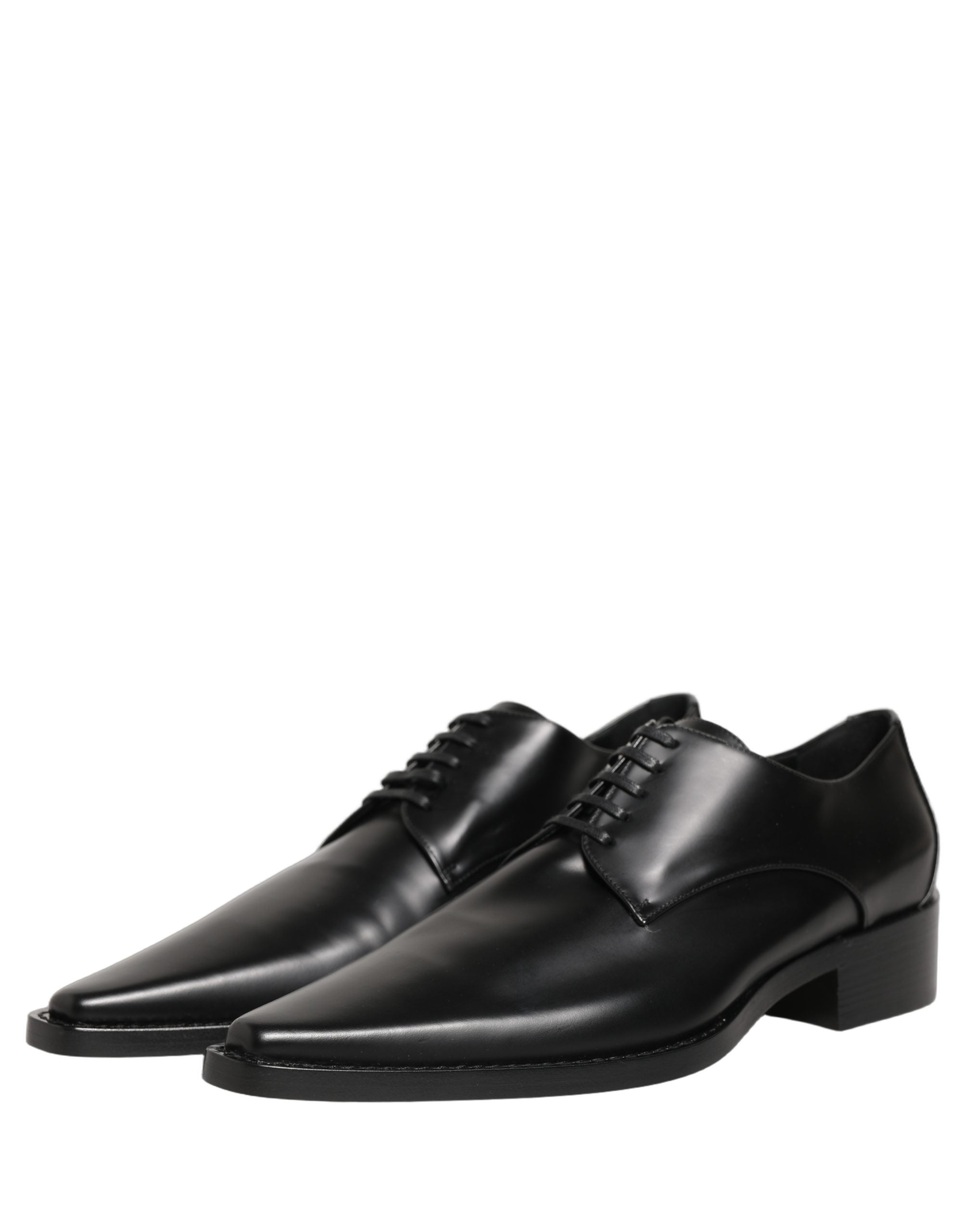 Female model wearing sleek black polished leather Derby shoes with a square toe, clean lace-up front, structured block heel, and high-gloss finish, captured mid-step in a casual lifestyle pose showcasing the shoe's sharp profile and sophisticated silhouette.