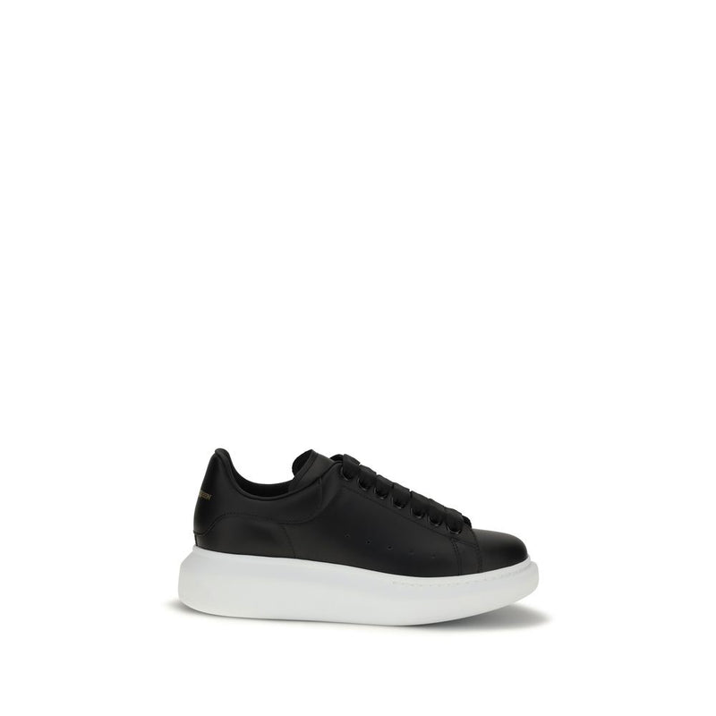 Black leather platform sneaker with a thick white rubber sole and wide black laces
