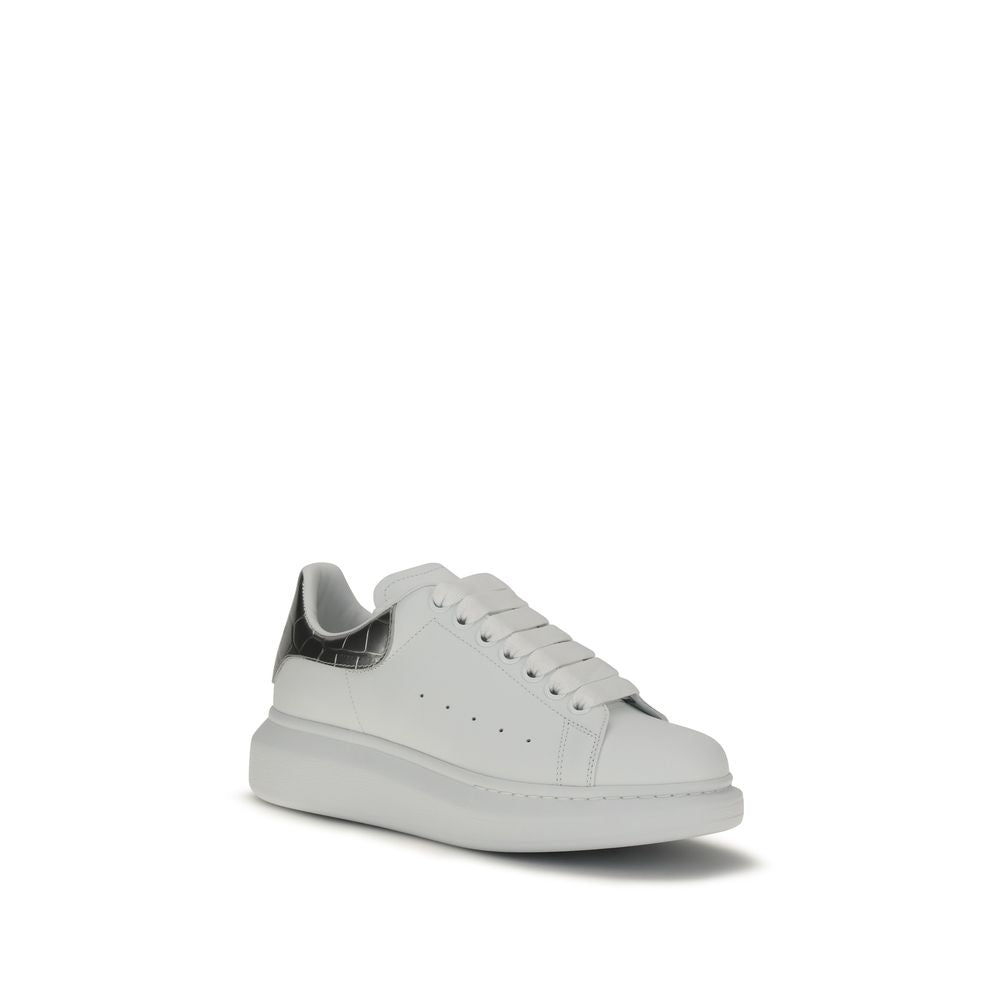 Alexander McQueen white leather platform sneaker with thick white laces and a metallic silver heel tab.