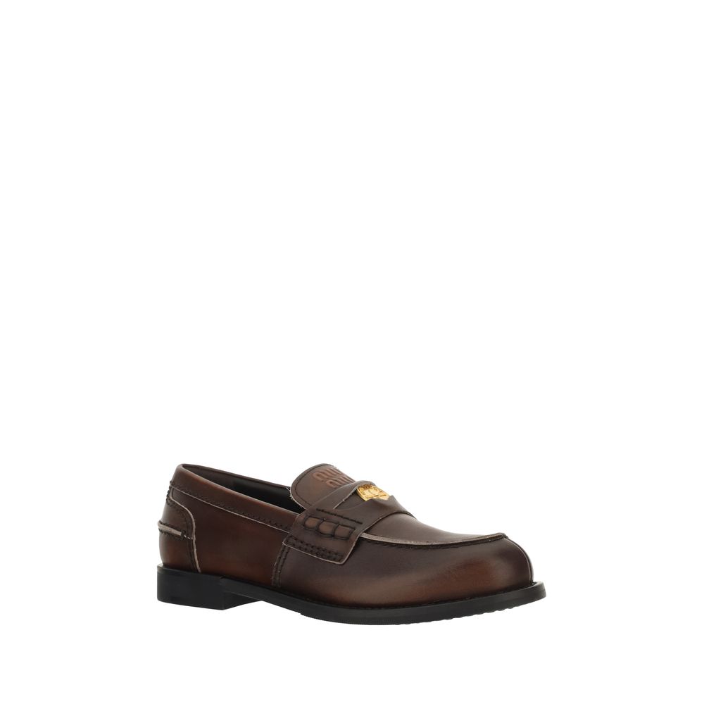Brown leather loafer shoe on a white background