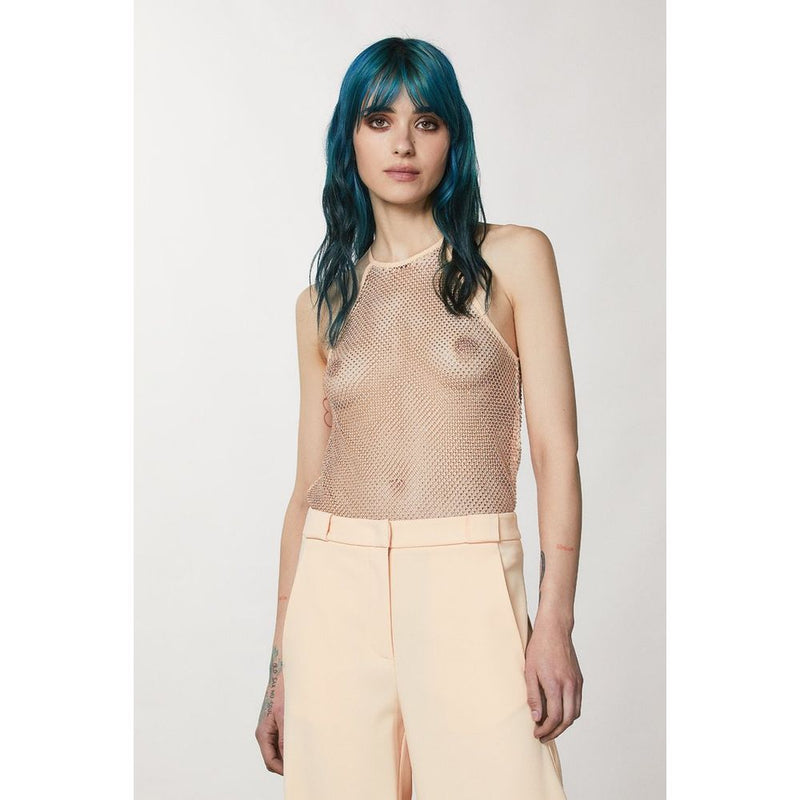 Model wearing a sleeveless pink mesh tank top with a high neckline