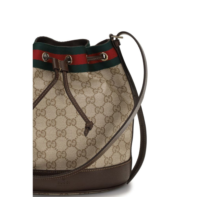 Beige monogram cotton bucket handbag with brown leather trim, drawstring, and red-green striped top band