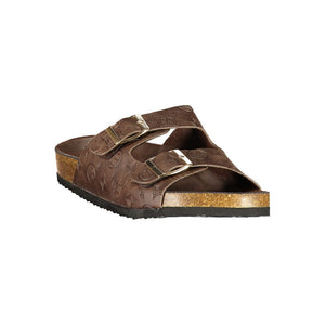 Laura Biagiotti brown polyurethane double-buckle slide sandal with embossed monogram pattern and cork-style midsole.