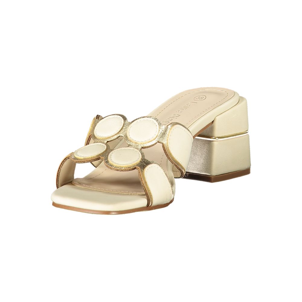 Female model wearing Laura Biagiotti beige polyurethane women's sandal with a warm beige upper, elegant strap detailing, and refined Italian craftsmanship, captured mid-step in a casual lifestyle pose showcasing the sandal's relaxed neutral charm and effortless summer sophistication