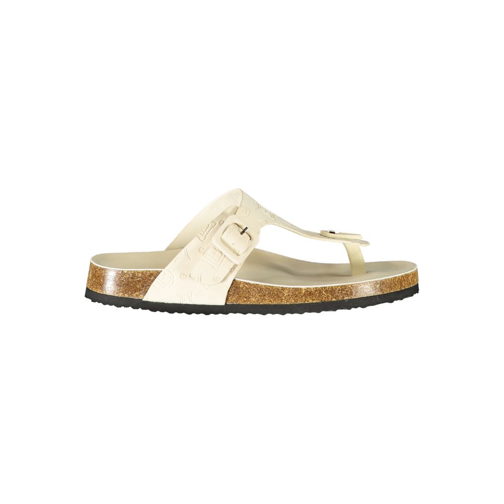 Female model wearing Laura Biagiotti bianco white polyurethane women's slide ciabatta with a clean white upper, effortless slip-on silhouette, and refined Italian craftsmanship, captured mid-step in a casual lifestyle pose showcasing the slide's crisp summer freshness and understated designer elegance.