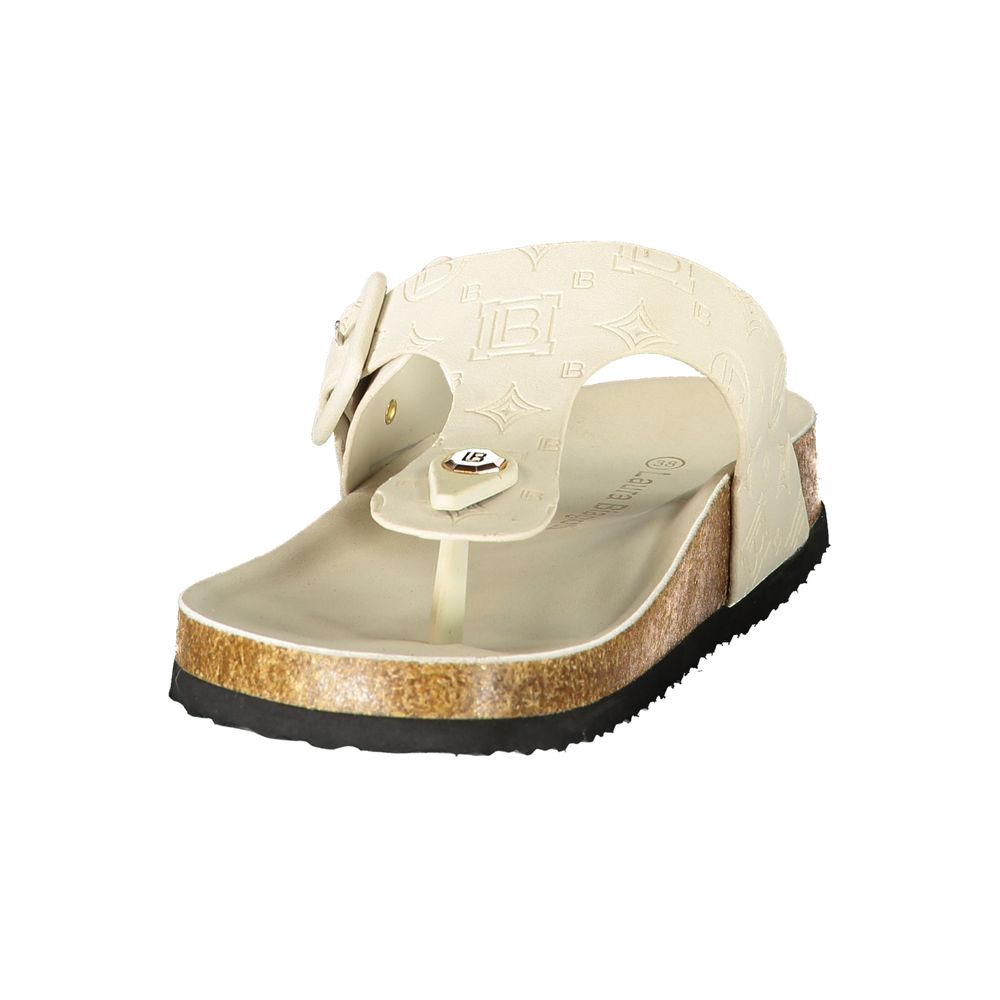 Female model wearing Laura Biagiotti bianco white polyurethane women's slide ciabatta with a clean white upper, effortless slip-on silhouette, and refined Italian craftsmanship, captured mid-step in a casual lifestyle pose showcasing the slide's crisp summer freshness and understated designer elegance.