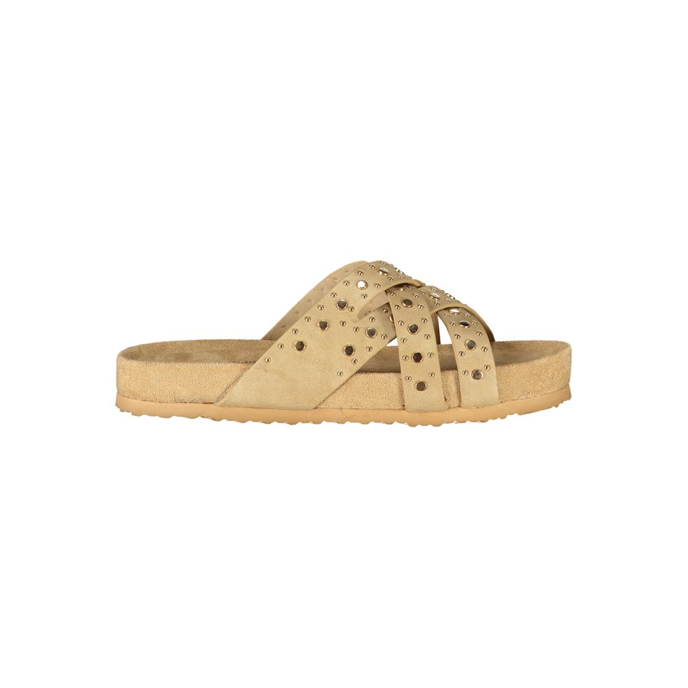 Beige polyurethane women's slip-on sandal with crisscross straps and gold stud detailing.