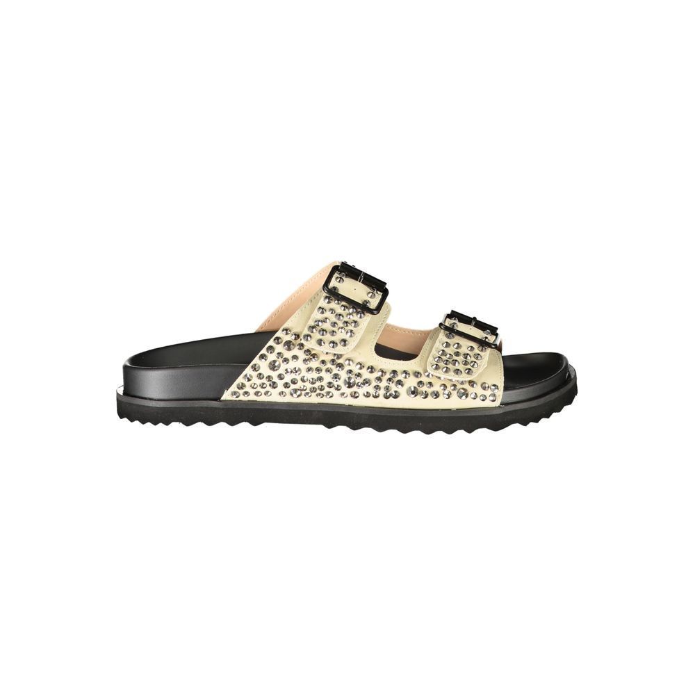 Female model wearing Laura Biagiotti beige polyurethane women's slipper with a warm beige upper, effortless slip-on silhouette, and refined Italian craftsmanship, captured mid-step in a casual lifestyle pose showcasing the slipper's understated luxury and relaxed everyday elegance.