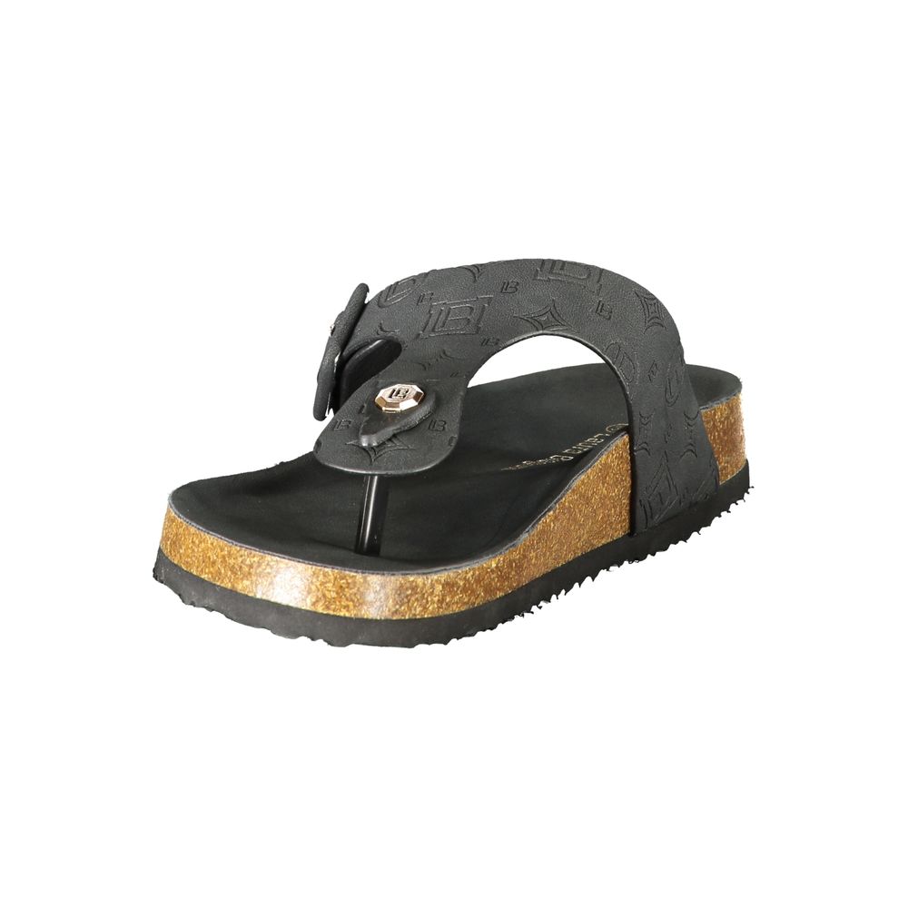Female model wearing Laura Biagiotti black polyurethane women's sandal with a sleek black upper, elegant strap detailing, and refined Italian craftsmanship, captured mid-step in a casual lifestyle pose showcasing the sandal's bold sophistication and effortless everyday luxury.

