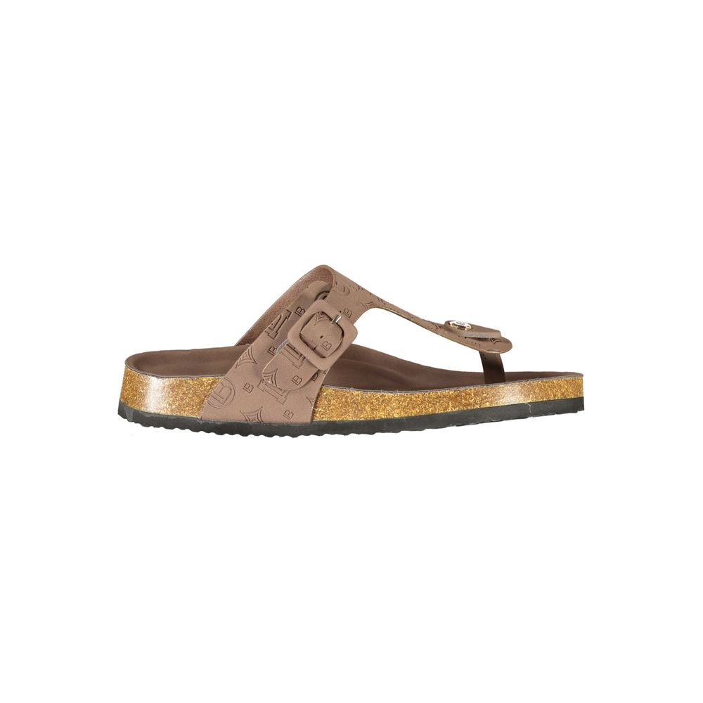 Female model wearing Laura Biagiotti brown polyurethane women's sandal with a rich warm brown upper, elegant strap detailing, and refined Italian craftsmanship, captured mid-step in a casual lifestyle pose showcasing the sandal's earthy warmth and effortless summer sophistication.