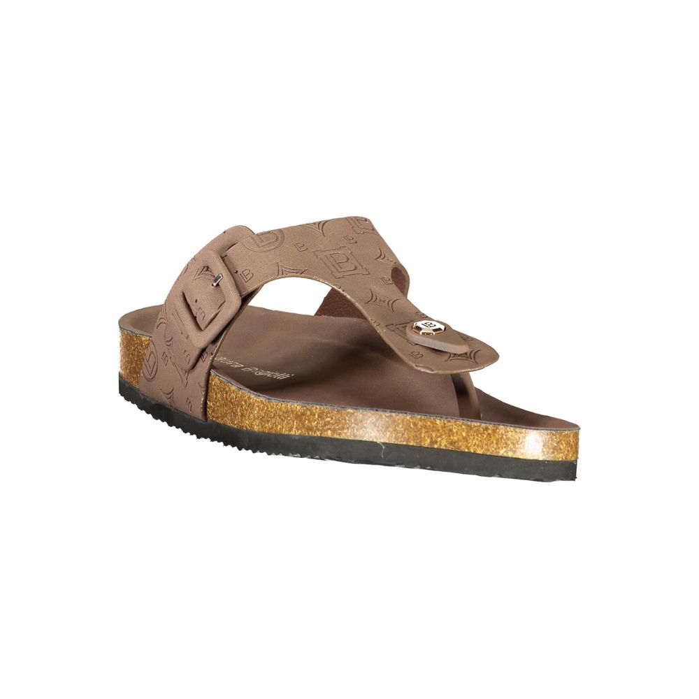 Female model wearing Laura Biagiotti brown polyurethane women's sandal with a rich warm brown upper, elegant strap detailing, and refined Italian craftsmanship, captured mid-step in a casual lifestyle pose showcasing the sandal's earthy warmth and effortless summer sophistication."