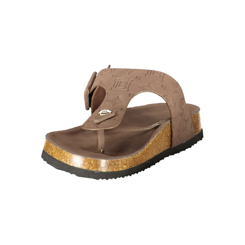 Female model wearing Laura Biagiotti brown polyurethane women's sandal with a rich warm brown upper, elegant strap detailing, and refined Italian craftsmanship, captured mid-step in a casual lifestyle pose showcasing the sandal's earthy warmth and effortless summer sophistication."