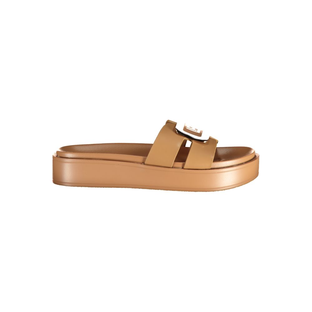 Female model wearing Laura Biagiotti beige polyurethane women's sandal with a warm beige upper, elegant strap detailing, and refined Italian craftsmanship, captured mid-step in a casual lifestyle pose showcasing the sandal's timeless neutral appeal and effortless summer elegance