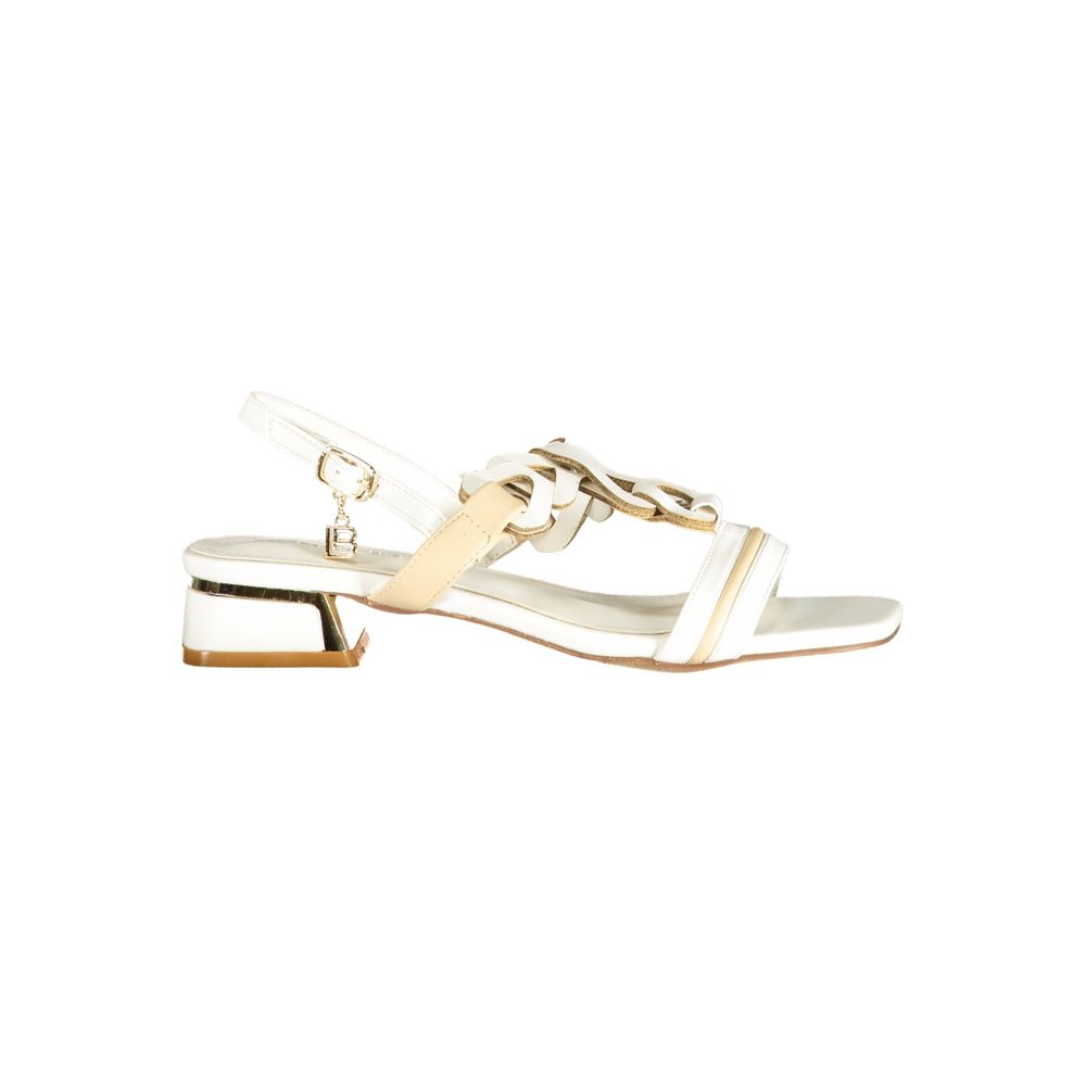 Female model wearing Laura Biagiotti white polyurethane women's sandal with a clean white upper, elegant strap detailing, and refined Italian craftsmanship, captured mid-step in a casual lifestyle pose showcasing the sandal's fresh summer brightness and effortless designer elegance.